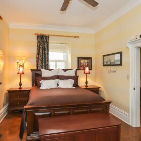 Image of the well appointed master bedroom in Meritage House, a historic rental property located in the heart of Niagara on the Lake.